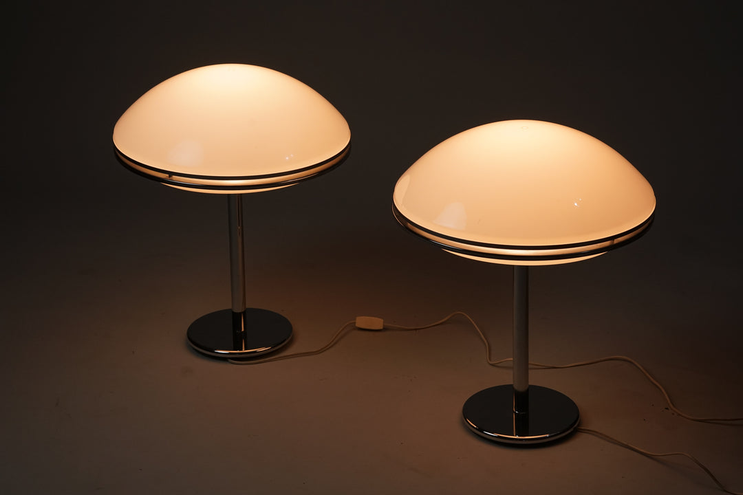 White acrylic lamp with chromed metal leg and detailing on the shade. 